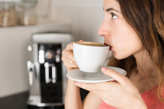 Profile of coffee drinking woman