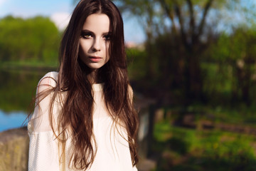 Portrait of a beautiful young brunette woman with long hair, lifestyle