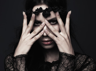 Studio portrait of a beautiful girl in Gothic style