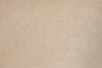 Fototapeta na wymiar Beige stone wall. Background texture