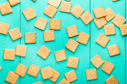cracers on wooden background top view
