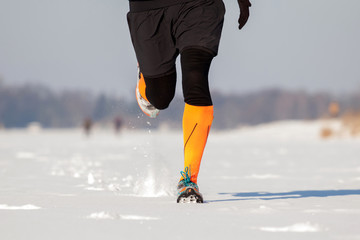Fototapeta na wymiar Winter jogging, running in the snow