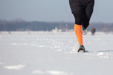 Winter jogging, running in the snow