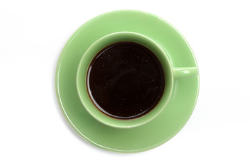 Black coffee in green cup, top view