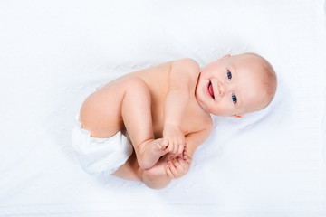 Little baby wearing a diaper - obrazy, fototapety, plakaty