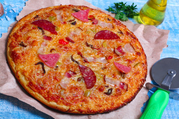close-up Delicious Meat Pizza with Ham, Bacon and sausages on the wooden background