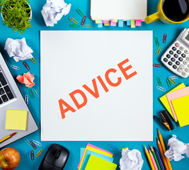 Advice motivation. Office table desk with supplies, white blank note pad, cup, pen, pc, crumpled paper, flower on wooden background. Top view