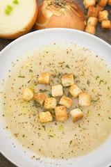 French onion soup on wooden table