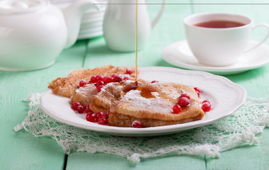 Fresh homemade crepes on plate with fresh berries