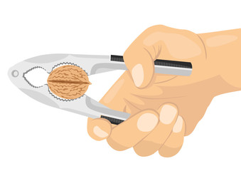 hand using a nutcracker to crack a nut
