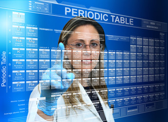 Scientific female touching a screen with the periodic table / researcher woman with periodic table...