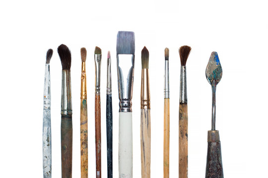Old oil paint brushes isolated