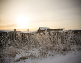 Snowy winter in russian village. Toned
