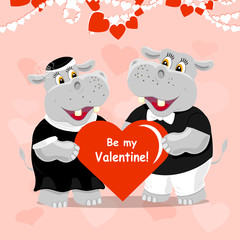 Be my Valentine lettering greeting card with two cute hippos in love.