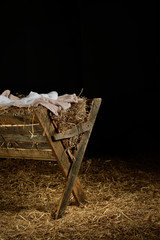 Manger with Clothes on Hay - obrazy, fototapety, plakaty
