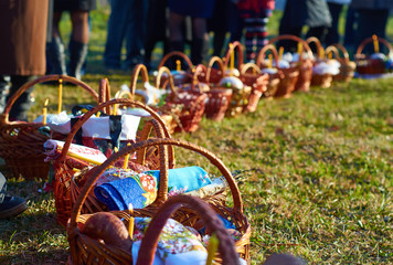 Easter baskets on green grass at sunny day.