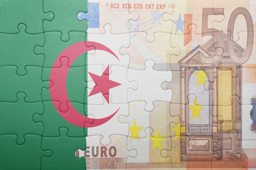 puzzle with the national flag of algeria and euro banknote