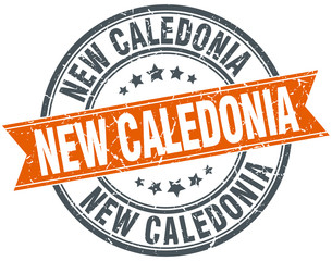 Fototapeta premium New Caledonia red round grunge vintage ribbon stamp