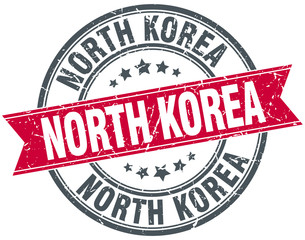North Korea red round grunge vintage ribbon stamp
