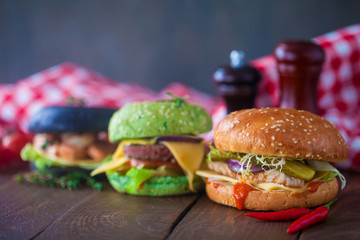 Home made burgers on wooden table