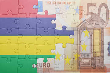 puzzle with the national flag of mauritius and euro banknote