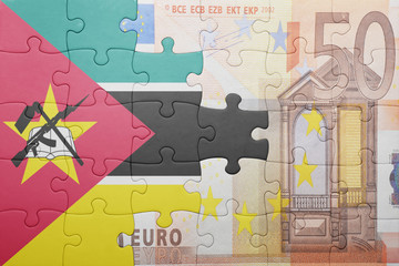 puzzle with the national flag of mozambique and euro banknote