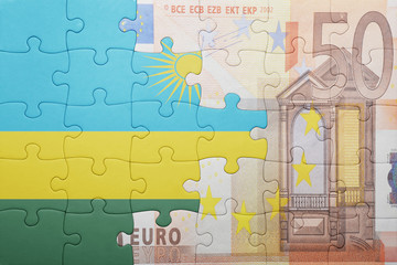 puzzle with the national flag of rwanda and euro banknote