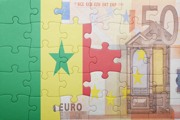 puzzle with the national flag of senegal and euro banknote
