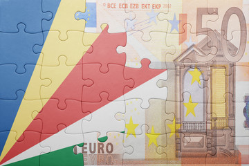 puzzle with the national flag of seychelles and euro banknote