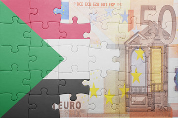 puzzle with the national flag of sudan and euro banknote