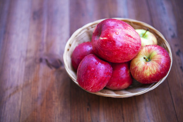 green and red apple isolated on a wooden background