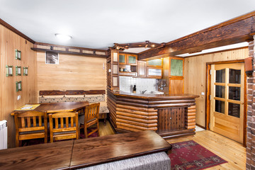 Traditional wooden interior with table and fixtures - mountain r