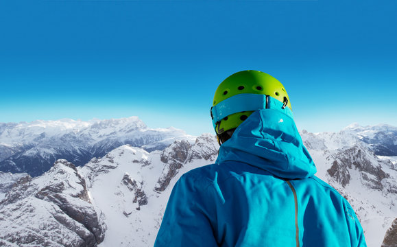 Back of skier during sunny day.
