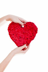 Woman Hands Hold Big Red Wicker Heart. Sign Of Love On White Background. Love Concept.