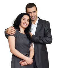 Happy couple dressed in classic clothes, portrait at studio on white