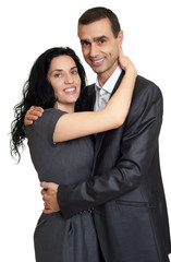 Happy couple dressed in classic clothes, portrait at studio on white