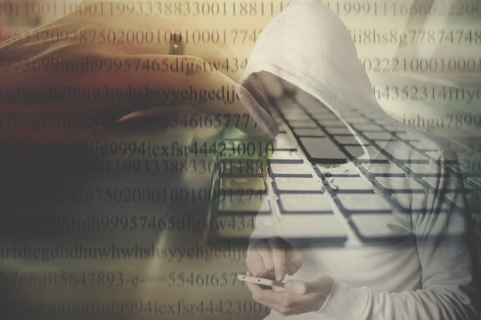 hooded anonymous computer hacker