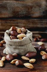 canvas bag with nuts on a wooden table