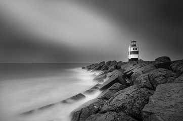Black and white picture and long exposure of the lighthouse in Ijmuiden.