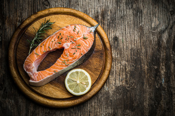 Fresh raw salmon on wooden cutting board