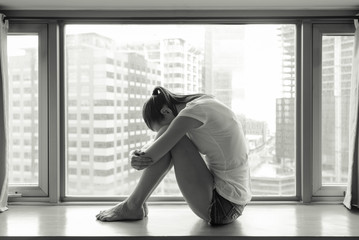 Sad and alone girl in the city. 
