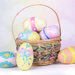 Painted Easter Eggs and Basket on a Colorful Background
