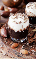 hot chocolate in glass cups and cream with nuts