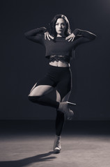 One girl posing in Vouge dance style.