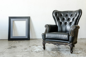 Black genuine leather classical style sofa in vintage room frame