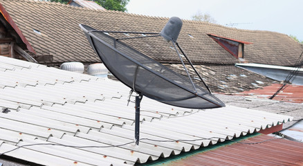 Satellite dish on background blue sky © pimonpim