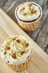 Toffee nut latte cupcake on wood plate