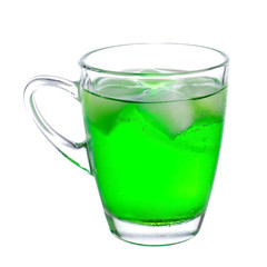 Green soda in glass on white background.