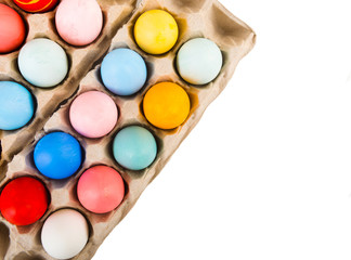 colored easter eggs in a carton