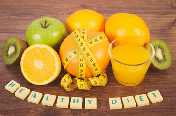 Fresh fruits, juice and tape measure, healthy lifestyles and nutrition